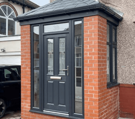 Brick porch with grey uPVC door and glazed panels